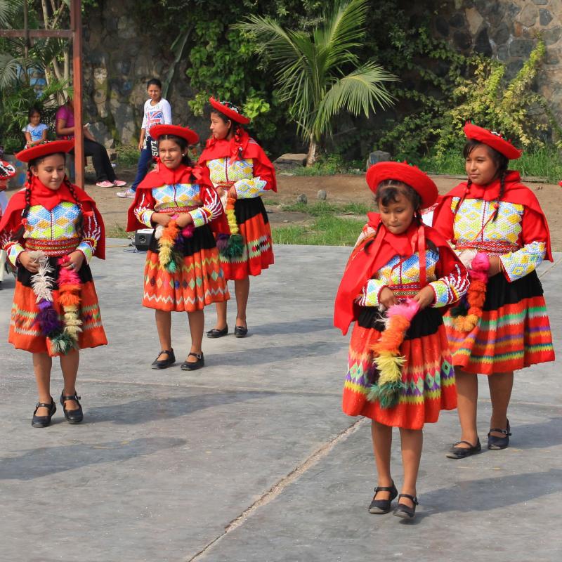 Children dancing in traditional Peruvian costumes